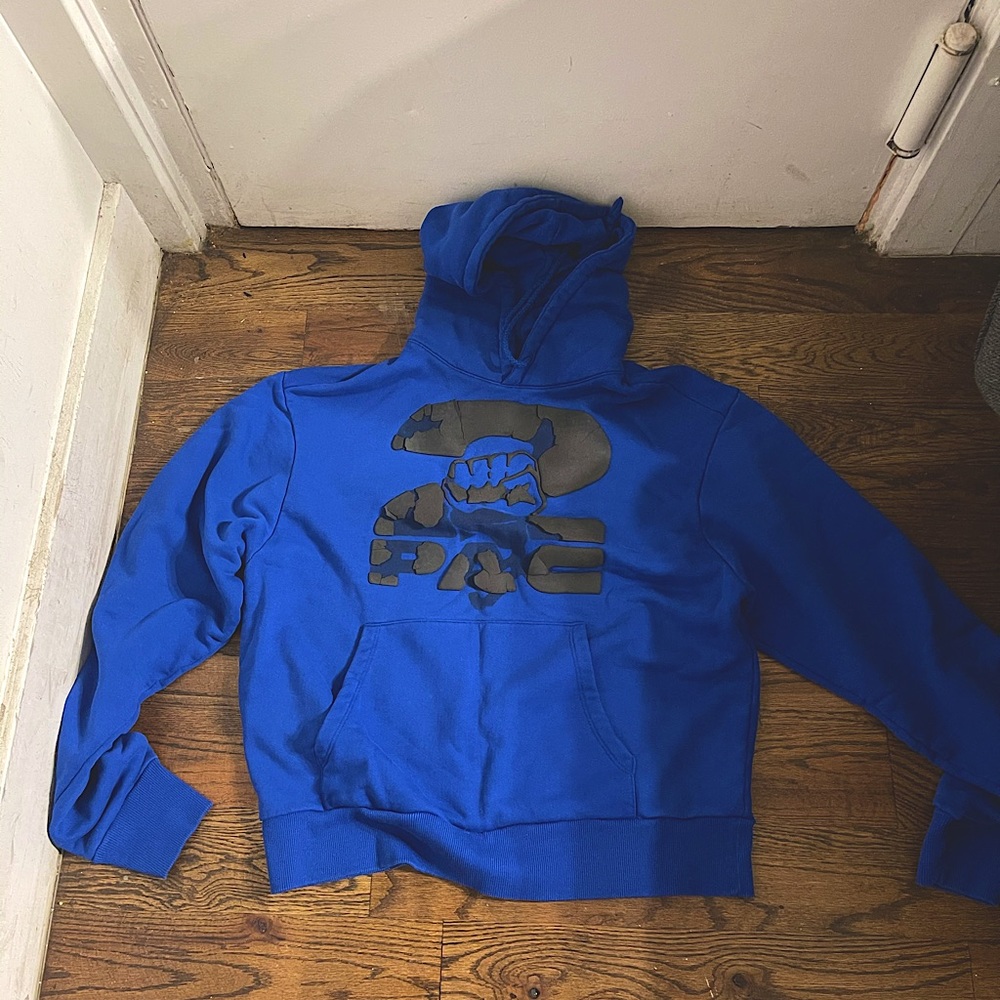 Medium Blue Hoodie. Says 2 PAC on the front